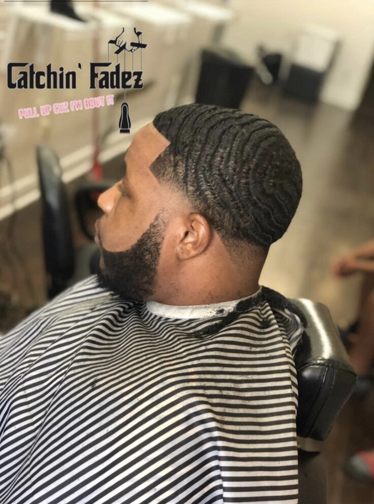 Client of Barber Christopher Austin Man with a fresh hair cut and waves