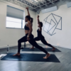 Two women doing yoga poses