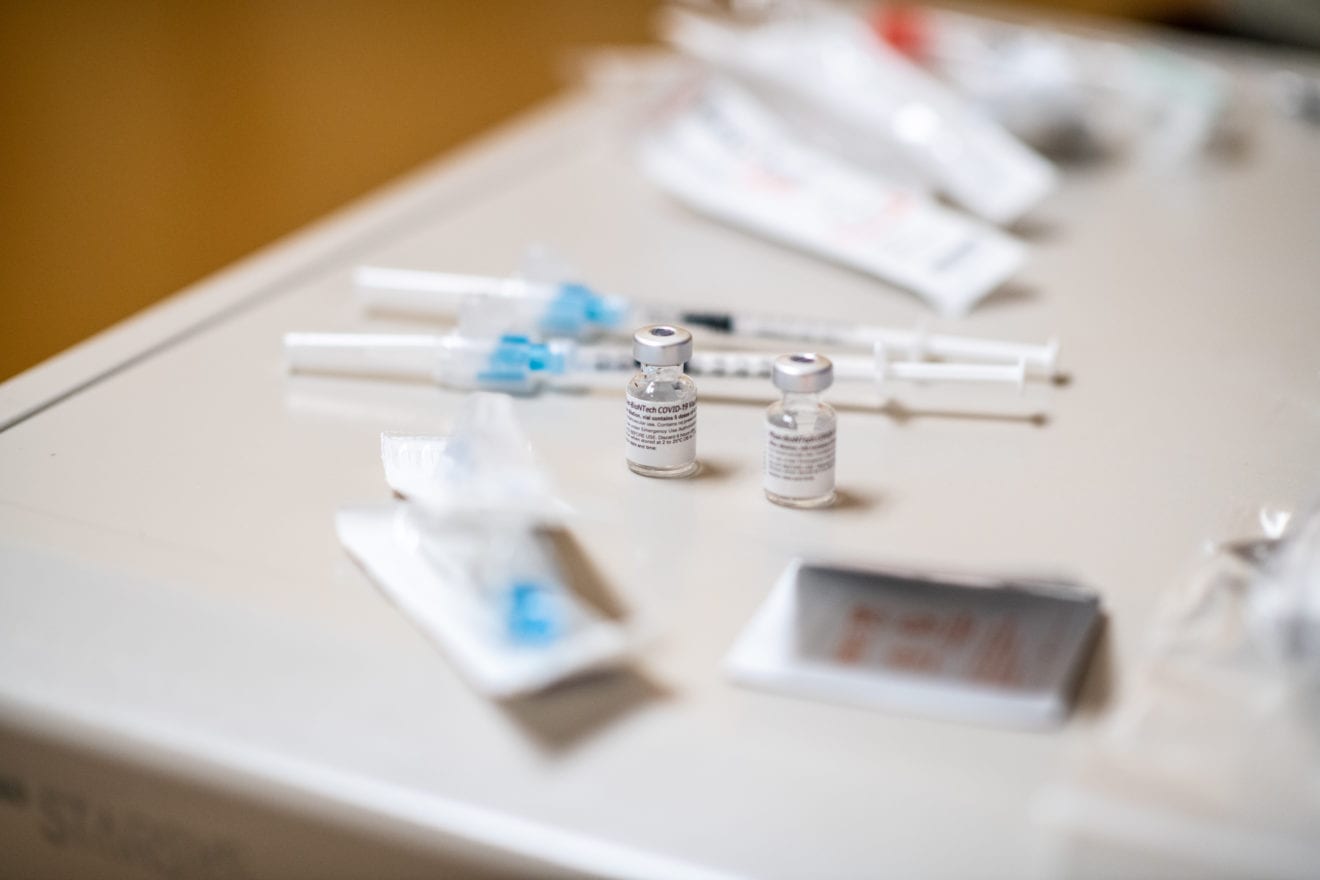 UAMS Third Dose vaccines lying on a table