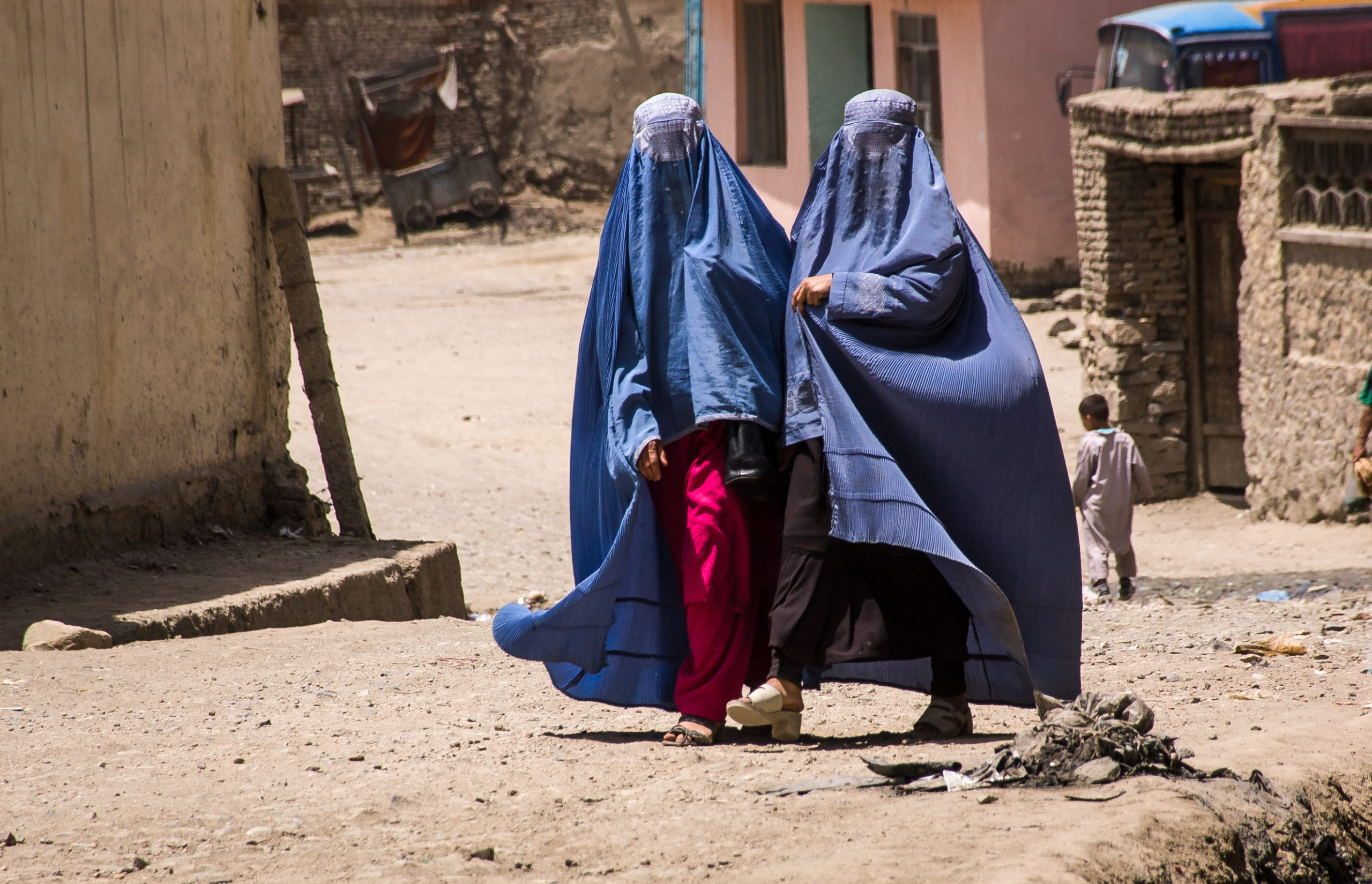 Afghan women in burqas walking in the street in Kabul Afghan women in burqas walking in the street in Kabul