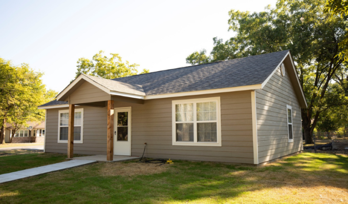 small house with beige siding